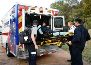 Paramedic Boarding A Patient Wallpaper