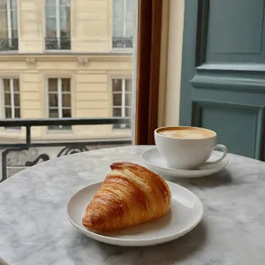 Parisian Coffeeand Croissant Scene Wallpaper