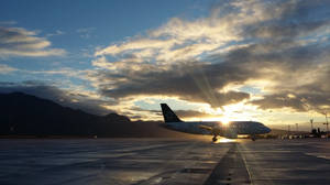 Parked Plane During Sunset Wallpaper