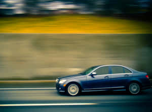 Passing Sedan Wallpaper