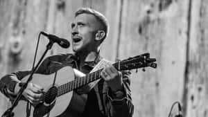 Passionate Guitarist Performance B W Wallpaper