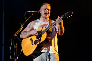 Passionate Guitarist Performing Live Wallpaper