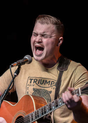 Passionate Guitarist Singing Live Wallpaper