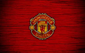 Passionate Manchester United Players Celebrating Victory Wallpaper