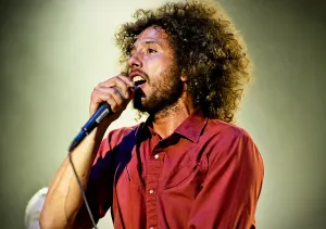 Passionate Rock Vocalist Performance Wallpaper