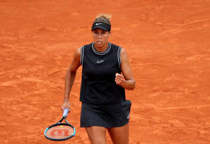 Passionate Tennis Star Madison Keys Holding Her Racket Wallpaper