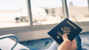 Passport Holding At Airport Wallpaper