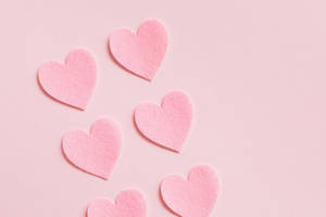 Pastel Pink Heart Cutouts In Pairs Wallpaper