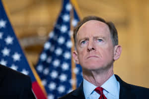 Pat Toomey In Front Of Flags Wallpaper