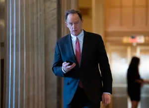 Pat Toomey Looking At Phone Wallpaper