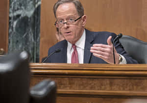 Pat Toomey Passionately Making A Point In A Committee Meeting Wallpaper