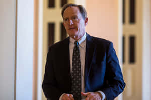 Pat Toomey With Hands On His Front Wallpaper