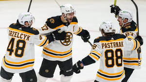 Patrice Bergeron Celebration With Teammates Wallpaper