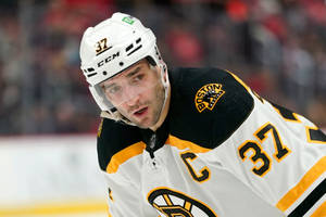 Patrice Bergeron White Boston Bruins Uniform Wallpaper