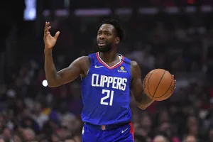 Patrick Beverly In Blue Clippers Jersey Wallpaper