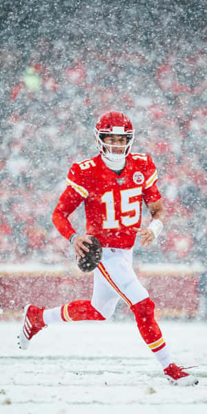 Patrick Mahomes Cool Match Versus Denver Broncos During Winter Wallpaper