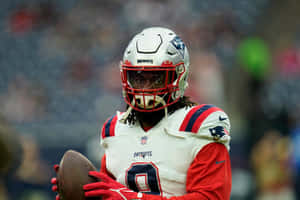 Patriots Player Holding Football Wallpaper