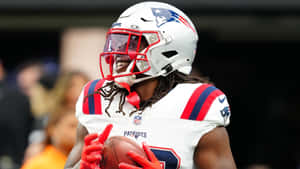 Patriots Player Smiling With Football Wallpaper