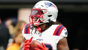 Patriots Player Smiling With Football Wallpaper