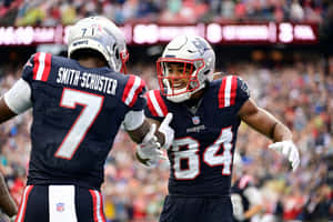 Patriots Players Celebrating On Field Wallpaper