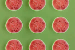 Patterned Watermelon Slices Green Background Wallpaper