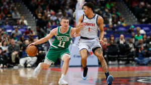 Payton Pritchard Driving To Basket Wallpaper