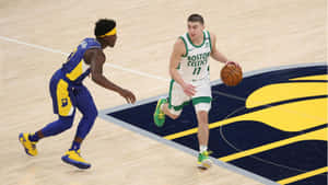 Payton Pritchard Driving To Basket Wallpaper