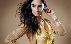 Paz Vega Striking A Pose In An Elegant Dress Wallpaper