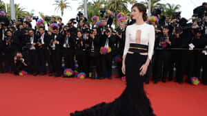 Paz Vega Striking A Pose In Elegant Attire Wallpaper