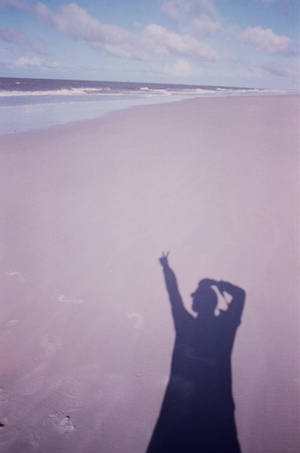 Peace Symbol Shadow On Beach Wallpaper