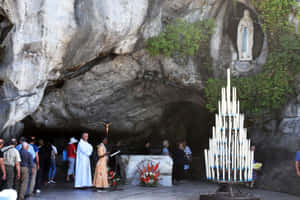 Peaceful Lourdes Sanctuary In Twilight Wallpaper