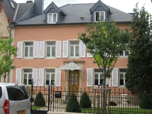 Peach Colored House Schifflange Luxembourg Wallpaper