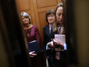 Peeking Through Door Lisa Murkowski Wallpaper