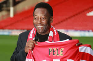 Pele Holding Red Jersey Wallpaper