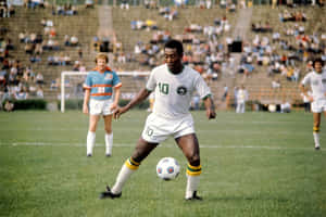 Pele Playing Soccer On Field Wallpaper