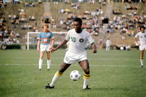 Pele Playing Soccer On Field Wallpaper