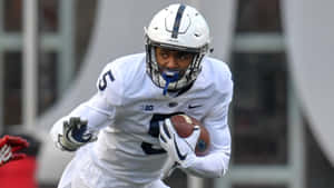 Penn State Football Player Running With Ball Wallpaper