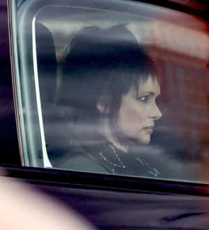Pensive Woman Car Window Wallpaper