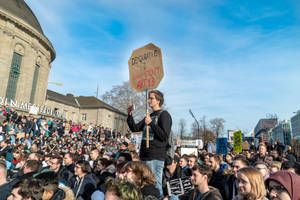 People Gathered At The Street Rallying Wallpaper