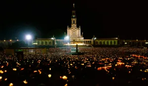 People Holding Lights Outside Fatima Sanctuary Wallpaper