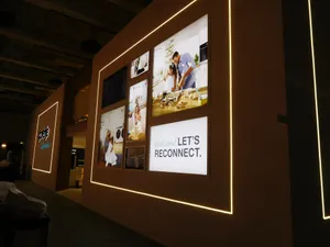 People Viewing Artwork At The International Art Exhibition Wallpaper