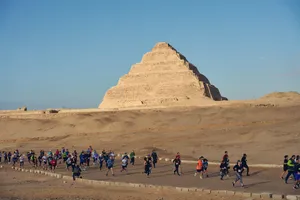 People Walking Around Saqqara Pyramid Wallpaper