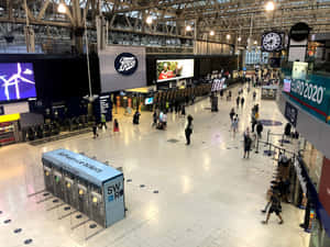 People Walking Around Waterloo Station Wallpaper