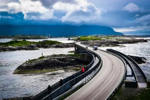 People Walking On The Storseisundet Bridge Wallpaper