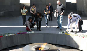 People With Flowers Armenian Genocide Memorial Wallpaper