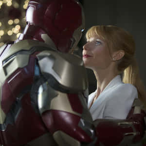 Pepper Potts Stunning Pose In Iron Man Suit Wallpaper