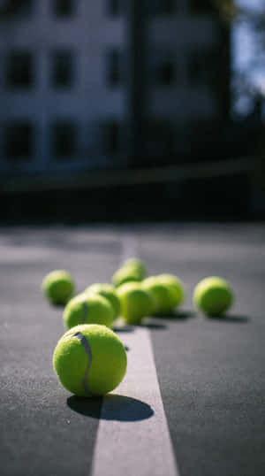 Perfectly Struck Tennis Ball Flying Through The Air. Wallpaper