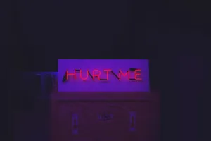 Person Holding Their Injured Hand Wallpaper