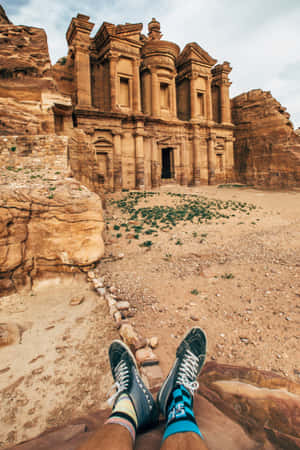 Person Shoes Against Petra Jordan Wallpaper