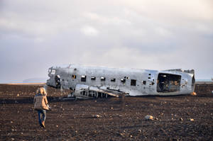 Person Walking To Plane Wreck Wallpaper